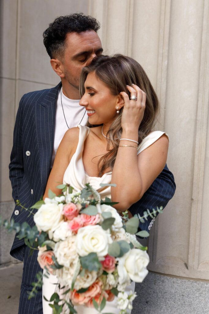 Newly married couple embracing each other.