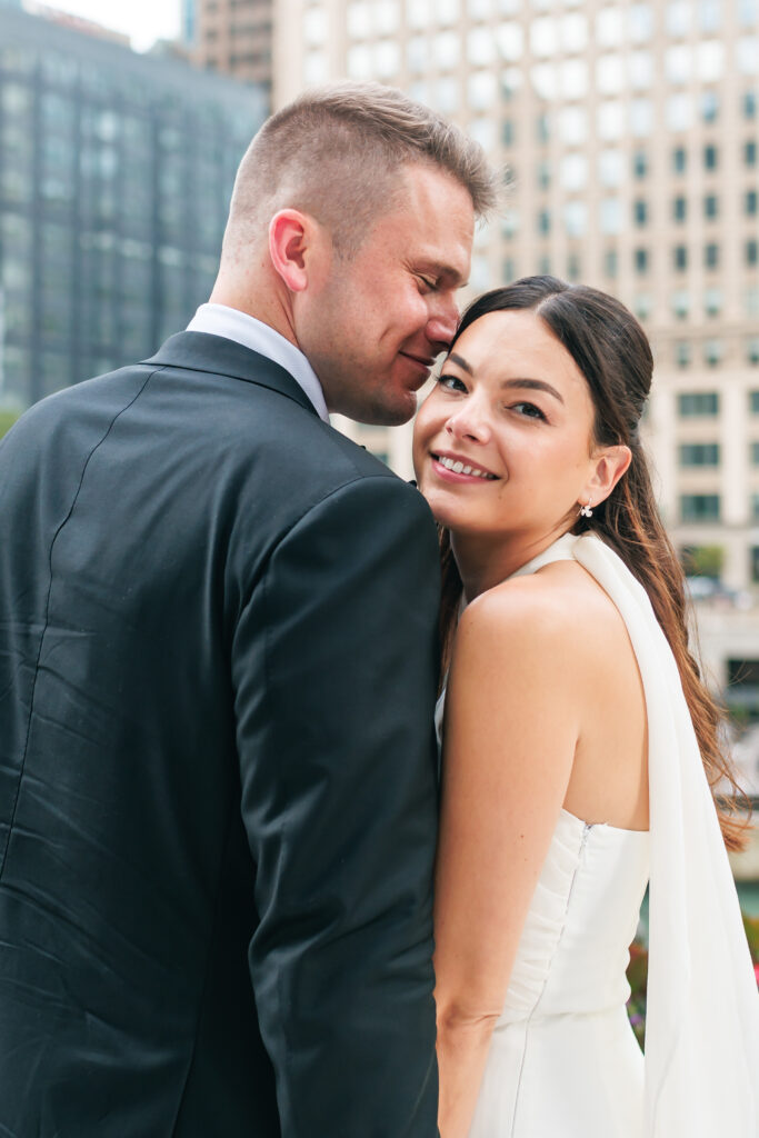 Newlyweds during golden hour portraits along the river in downtown Chicago after their intimate wedding