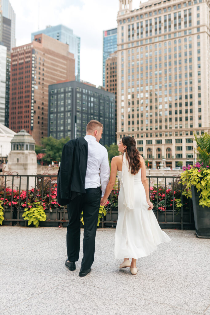 Newlyweds during golden hour portraits along the river in downtown Chicago after their intimate wedding