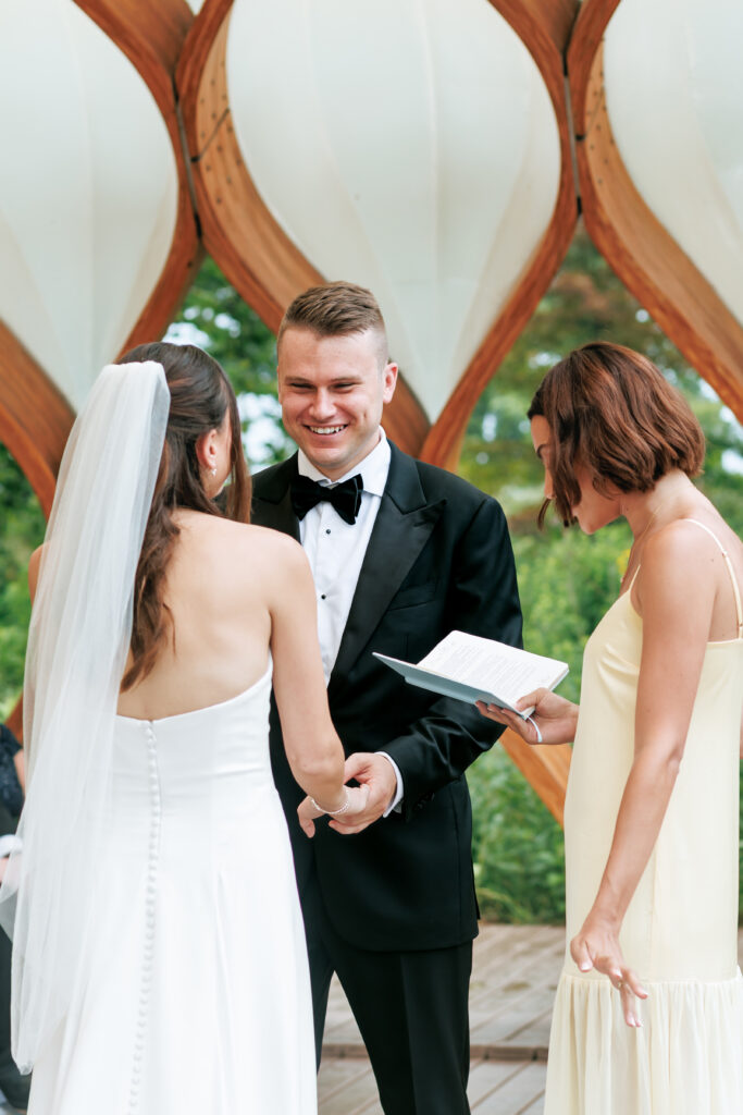 Bride and groom exchange vows at the Honeycomb Pavilion in Lincoln Park during their intimate Chicago wedding