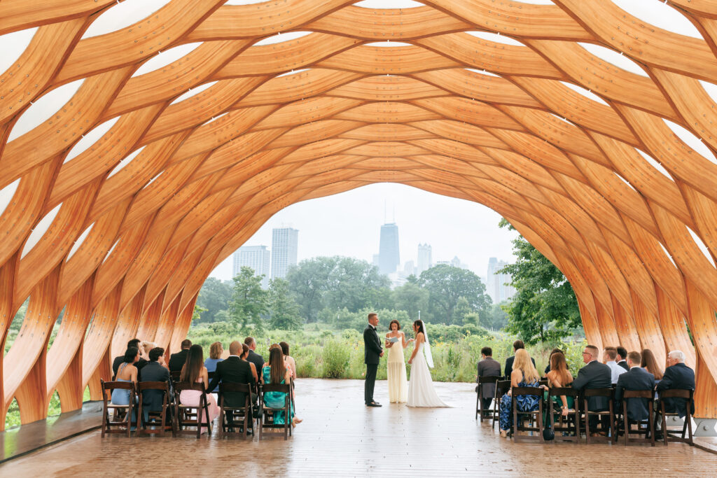 Bride and groom exchange vows at the Honeycomb Pavilion in Lincoln Park during their intimate Chicago wedding