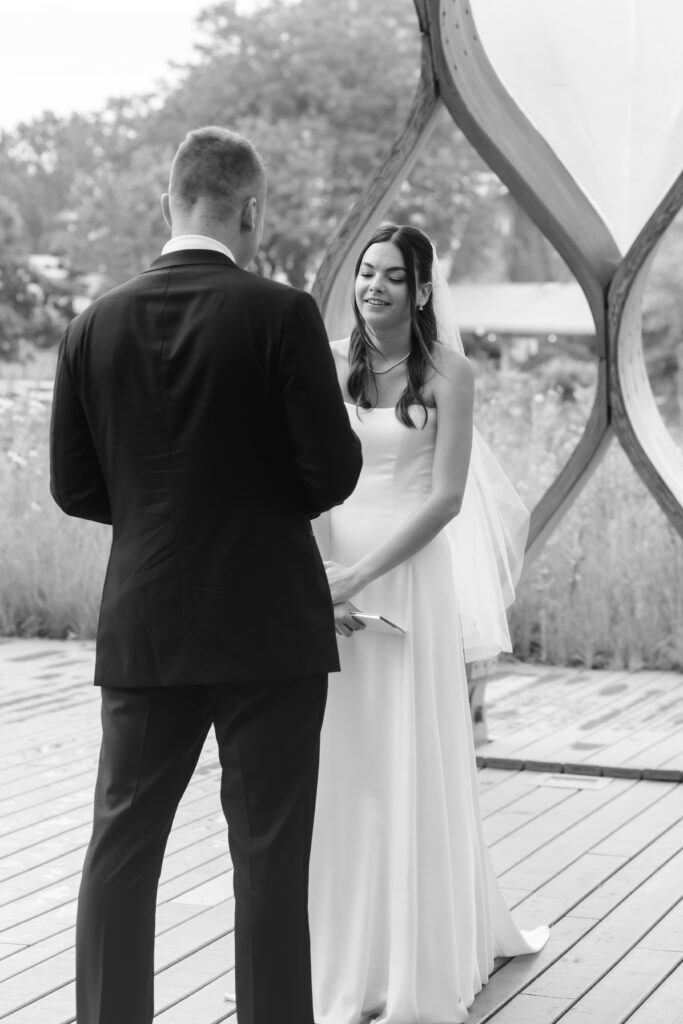 Bride and groom exchange vows at the Honeycomb Pavilion in Lincoln Park during their intimate Chicago wedding