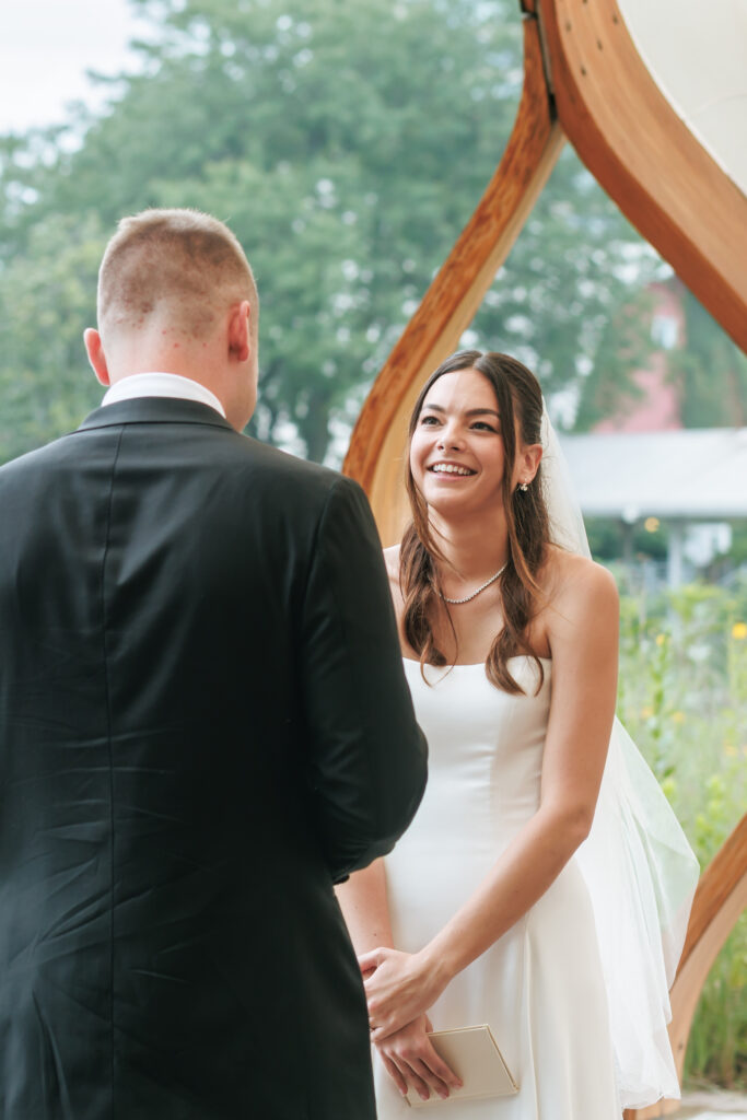 Bride and groom exchange vows at the Honeycomb Pavilion in Lincoln Park during their intimate Chicago wedding