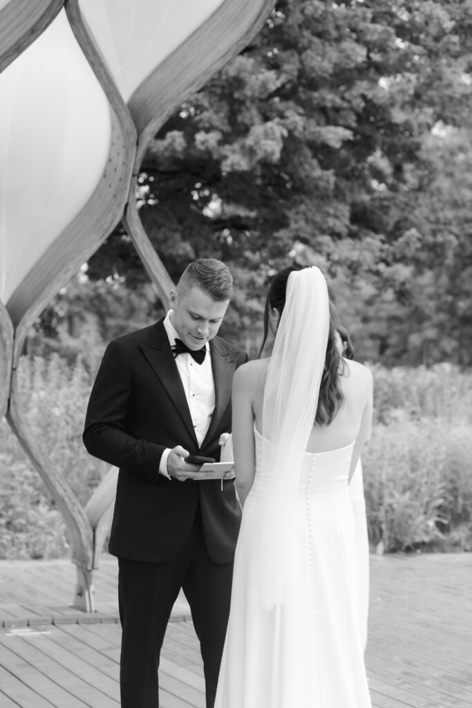 Bride and groom exchange vows at the Honeycomb Pavilion in Lincoln Park during their intimate Chicago wedding