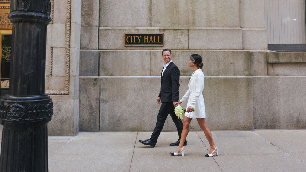 Couple outside Chicago City Hall on their elopement day