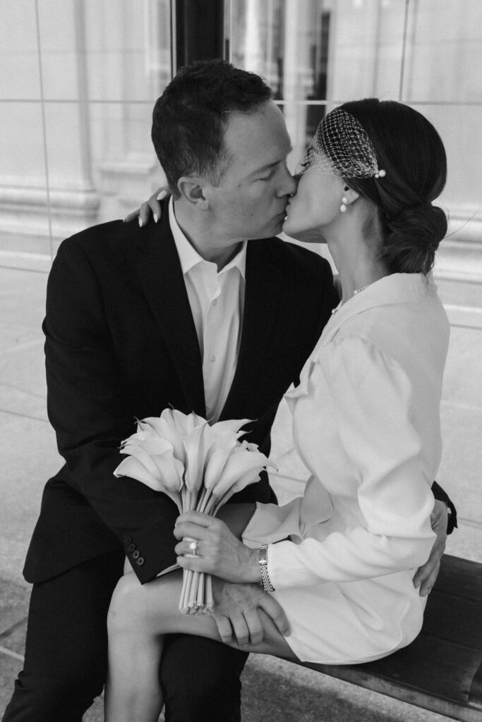 Newlyweds sharing a kiss.