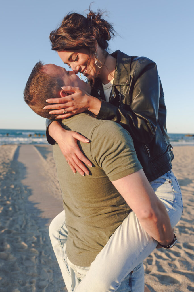 Playful engagement photo at North Avenue Beach