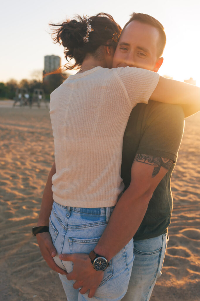 Romantic engagement photo with Chicago skyline at North Avenue Beach