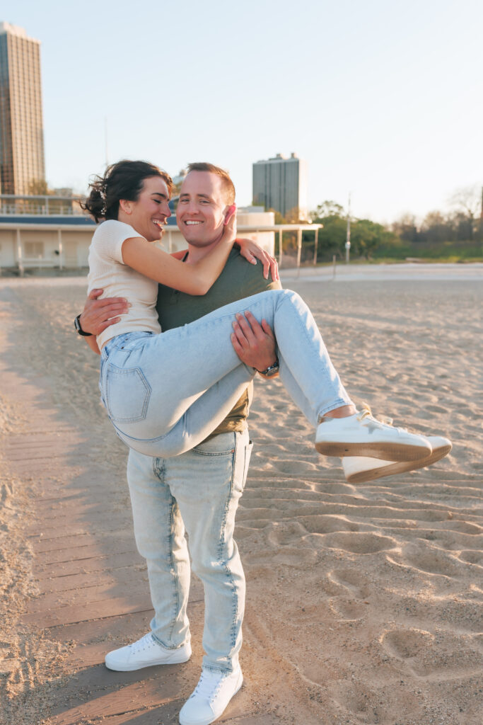 Playful engagement photo at North Avenue Beach