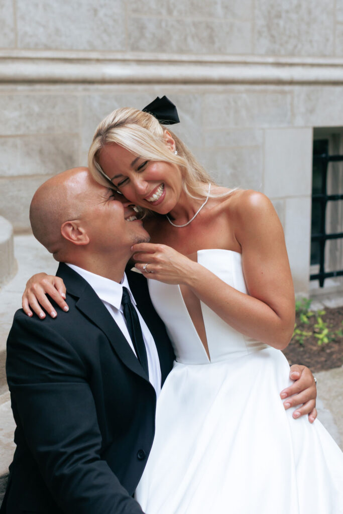 Couple laughing together in the ivy-covered courtyard of 4th Presbyterian Church in downtown Chicago