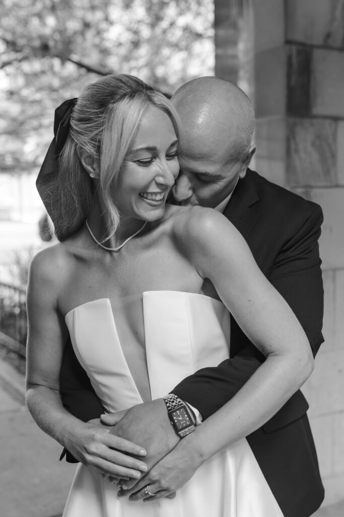 Couple laughing together in the ivy-covered courtyard of 4th Presbyterian Church in downtown Chicago